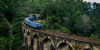 The Nine Arch Bridge is a beautiful colonial-era viaduct surrounded by lush greenery, offering stunn
