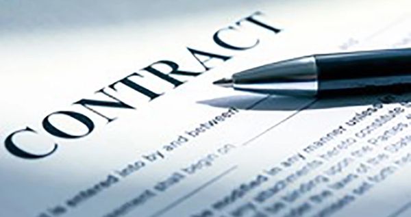 Close-up of a contract and pen.