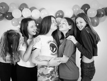 group of girls giggling having fun at a birthday party 