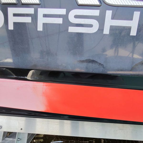 Close-up of a surface with the word 'OFFSH'.