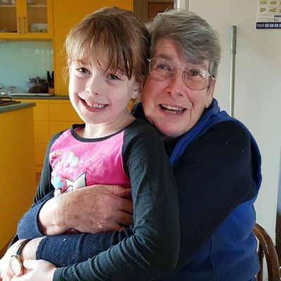 Ali and Grandmah sitting together at Grandmah's house.