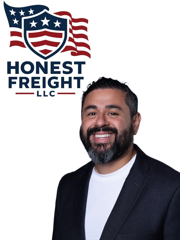 Kevin Castro standing beside Honest Freight LLC logo