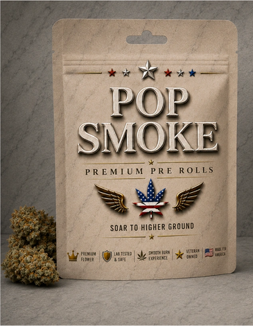 Premium Pop Smoke pre-rolls packaging with cannabis buds beside it.