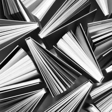 Open books arranged in an artistic pattern.