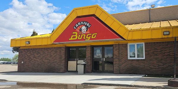 Exterior of a Carnival Bingo building on a sunny day.