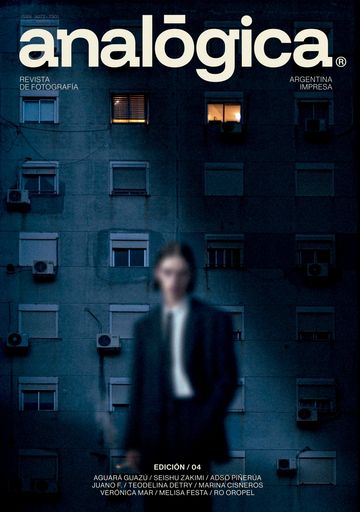 Cover of Analógica magazine featuring a blurred figure against a dark apartment building at night.