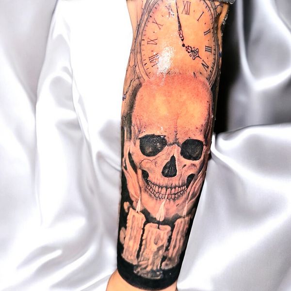 Skull clock and candle arm sleeve tattoo idea