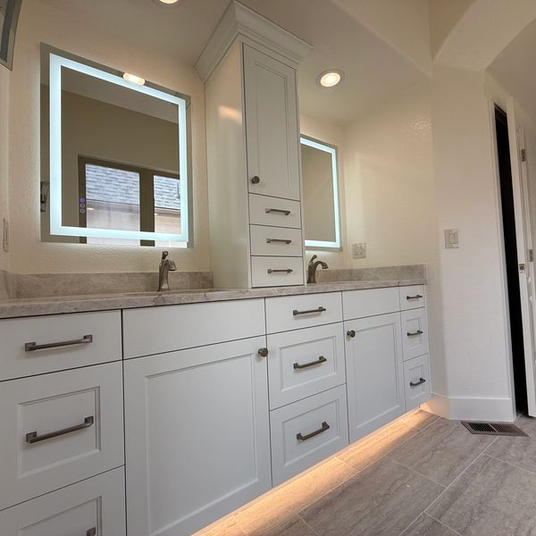 This functional master bath vanity, built with solid maple and finished with a superior white paint.