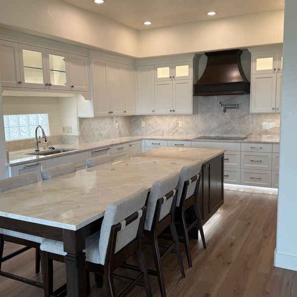 This kitchen is a balanced mix of framed inset and frameless cabinetry with soft close Blum hardware