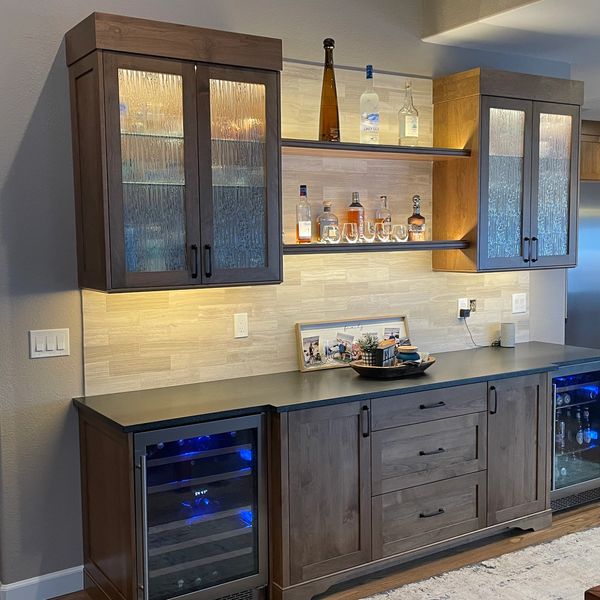 Alder solid wood with soft-close hardware, featuring a mix of frameless and inset cabinetry.