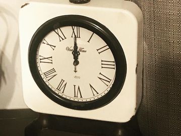 This Farmhouse Style metal clock is black and white and can be purchased at Hobby Lobby. 
