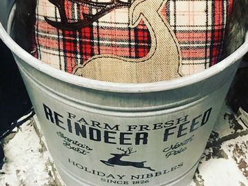 Farm Fresh reindeer Feed Galvanized bucket and red plaid reindeer pillow inside.