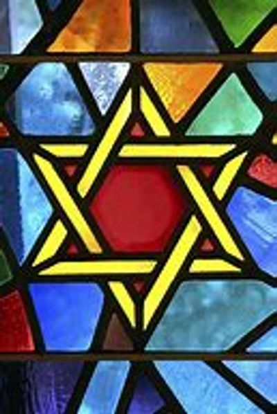Stained glass with a yellow Star of David.