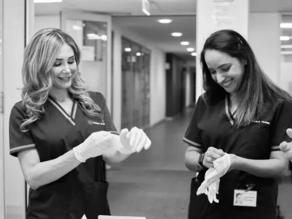Nurses donning gloves