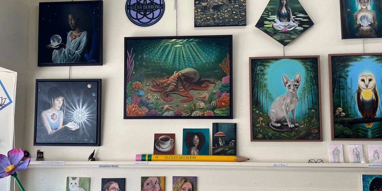 Art gallery wall featuring mystical and nature-inspired paintings with animals and human figures.