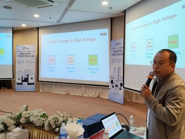 Man giving presentation on high voltage concepts.