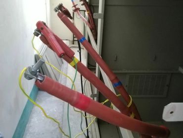 Red insulated electrical cables with connectors.
