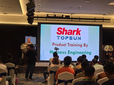 Speaker presenting at Shark Topsun product training event.