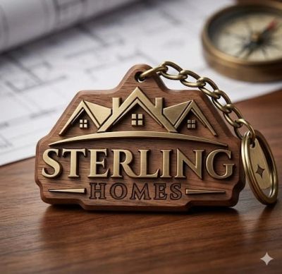 Wooden keychain with Sterling Homes logo and house design.