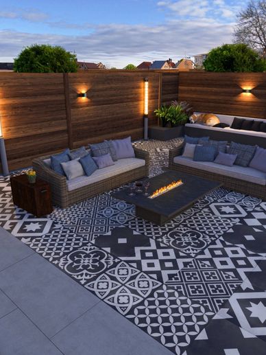 Cozy outdoor seating area with patterned tiles and warm lighting.