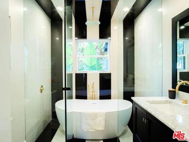 Thinking outside the box on this bathroom remodel. Shower and bathe at the same time. 