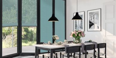 clic fit pleated blinds in a dining room on bi-fold doors