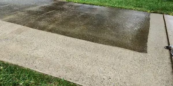 Concrete cleaning in progress – before and after by Clarksville Exterior Cleaning