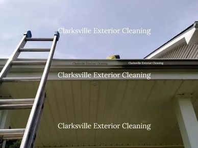 Rain gutter stain removal in progress.