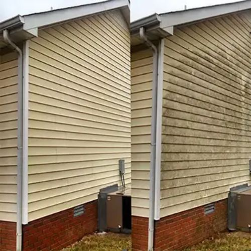 Professional pressure washing service in Clarksville TN - Team member is house washing vinyl siding