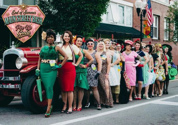 Group of women in vintage outfits at Main Street Bash.