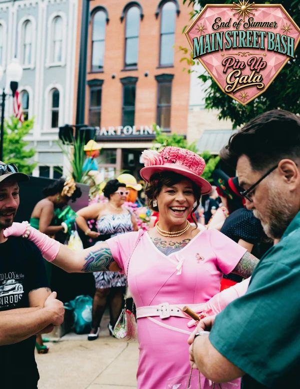 Woman in pink at Main Street Bash Pin Up Gala.