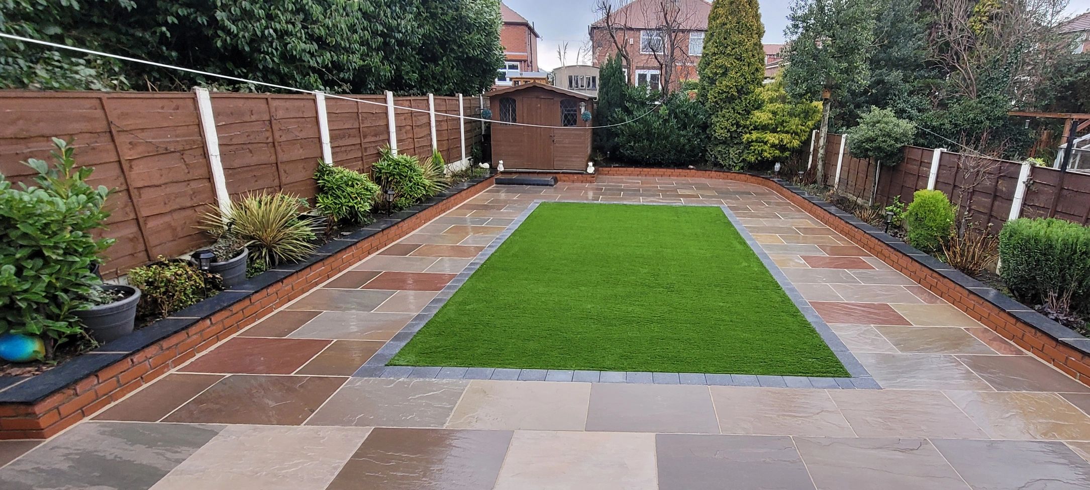 Sandstone paving with artificial grass