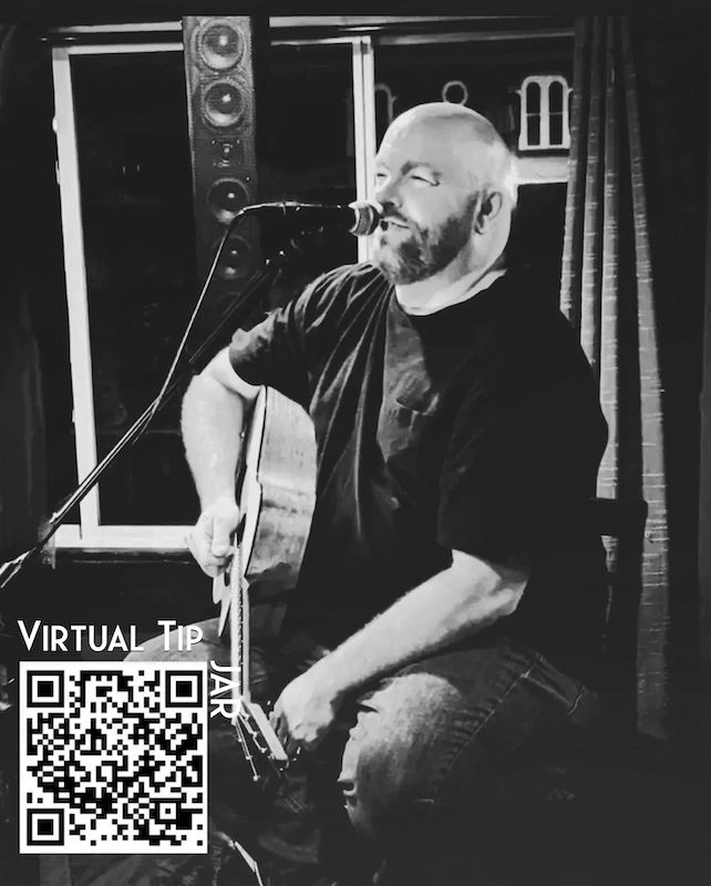 Man playing guitar and singing into a microphone, with a virtual tip QR code.