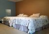 Each spacious guest room has two double beds with fresh linens, full sized bathtub and a private bathroom.