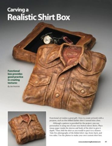 Detailed carving of a realistic folded shirt box with textured wood.