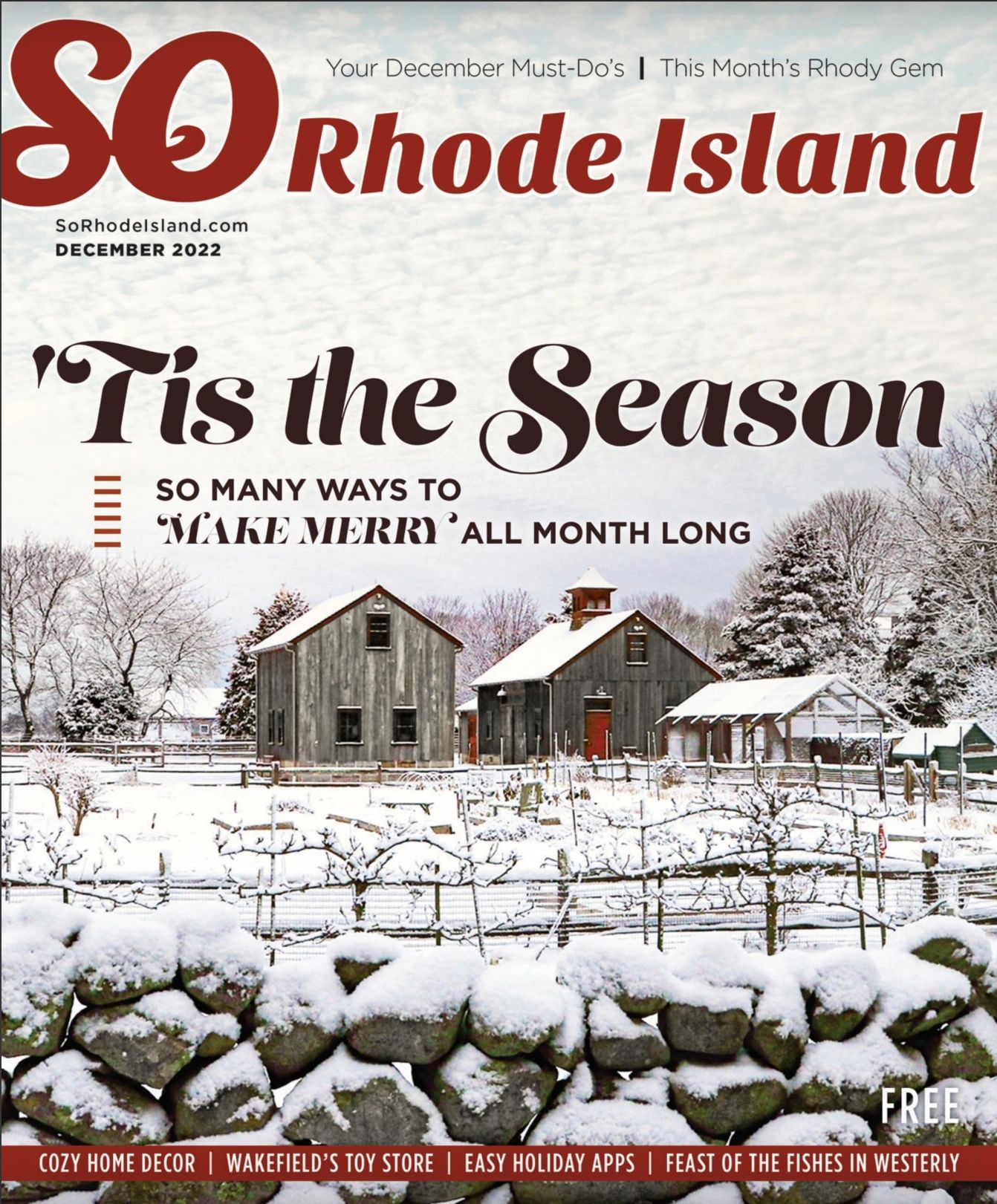 Rhode Island winter scene with snow-covered barns and stone wall.