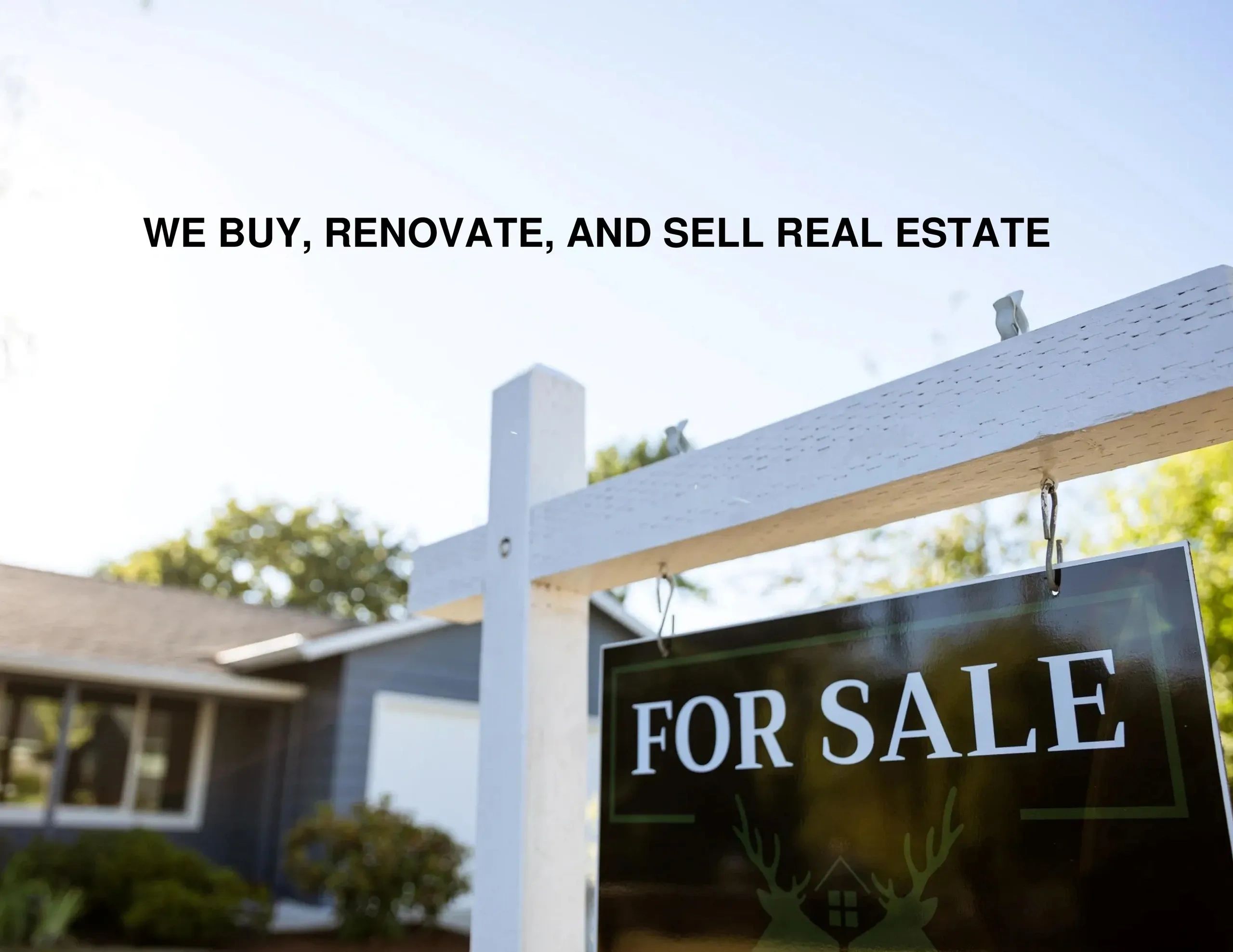 Real estate for sale sign with renovation ad.