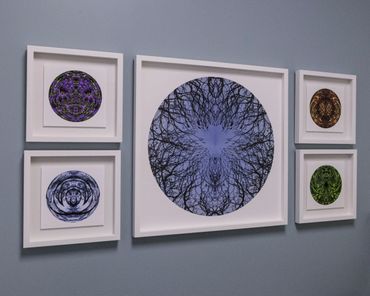 Array of 5 circular photos, 1 larger with a pair of smaller on either side.  