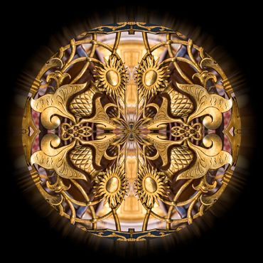  A gilded wrought iron pattern adorns this glowing orb.