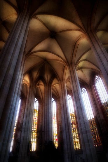 archways in the church provide flowing lines high up into the ceiling.