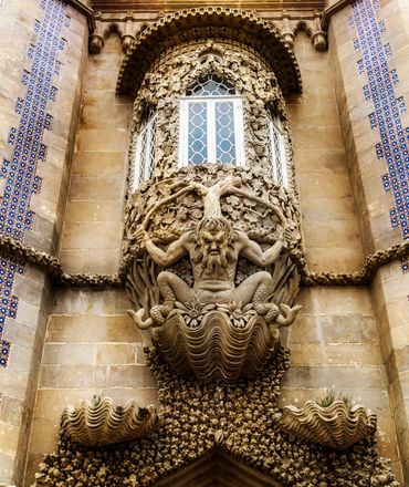 Triton sculpture symbolizes Creation.  Below him the ocean and above him the Tree of Life. 