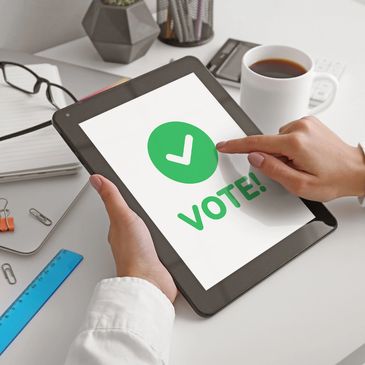 A constiutient voting on an online poll using a tablet.