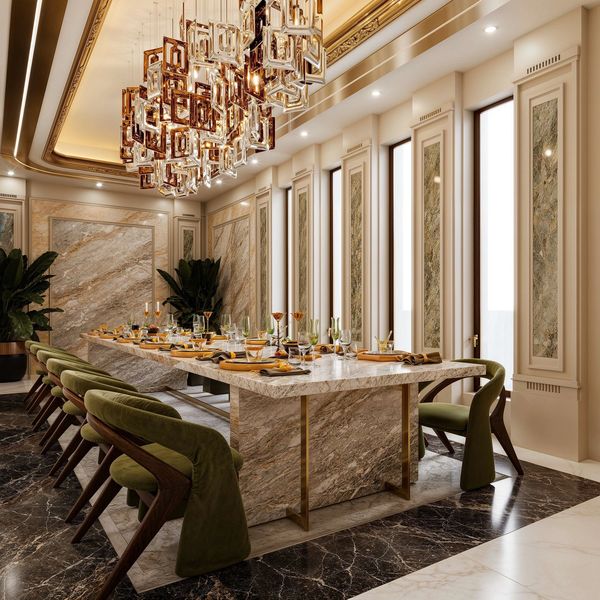 Luxurious dining room with marble table and modern chandelier.