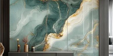 Elegant marble wall with gold veins behind modern sideboard.