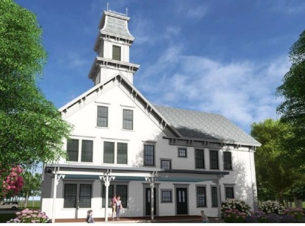 Historic white church building with a tall steeple and porch.
