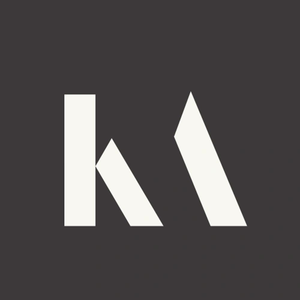 Minimalist white 'k' and 'a' letters on a dark background.