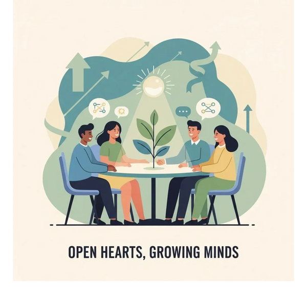 Four people discussing ideas around a table with a growing plant symbolizing growth.