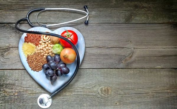 A image with stethoscope and fruits in the plate