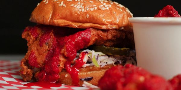 Chicken 65 Sandwich in the background with Chicken 65 Nuggets in the front