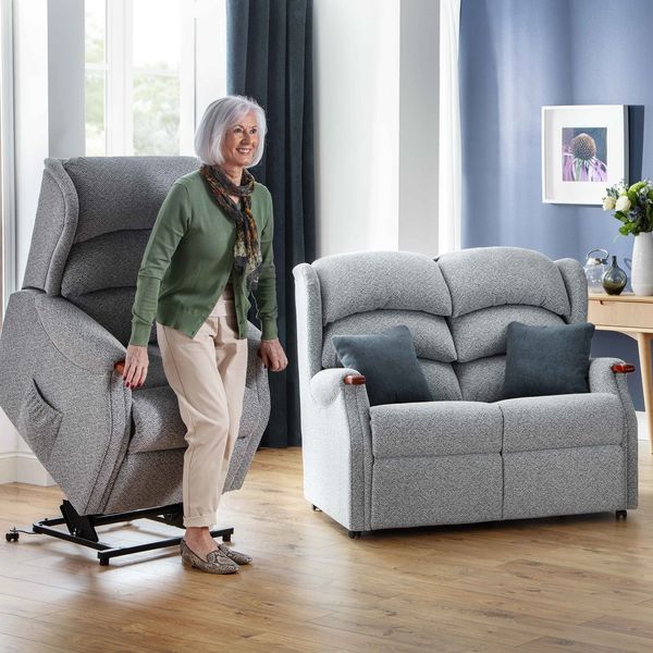 Fabric and leather riser recliner chairs with matching sofa